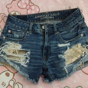 American Eagle Outfitters Blue Jean Shorts with Flower Pocket Design
